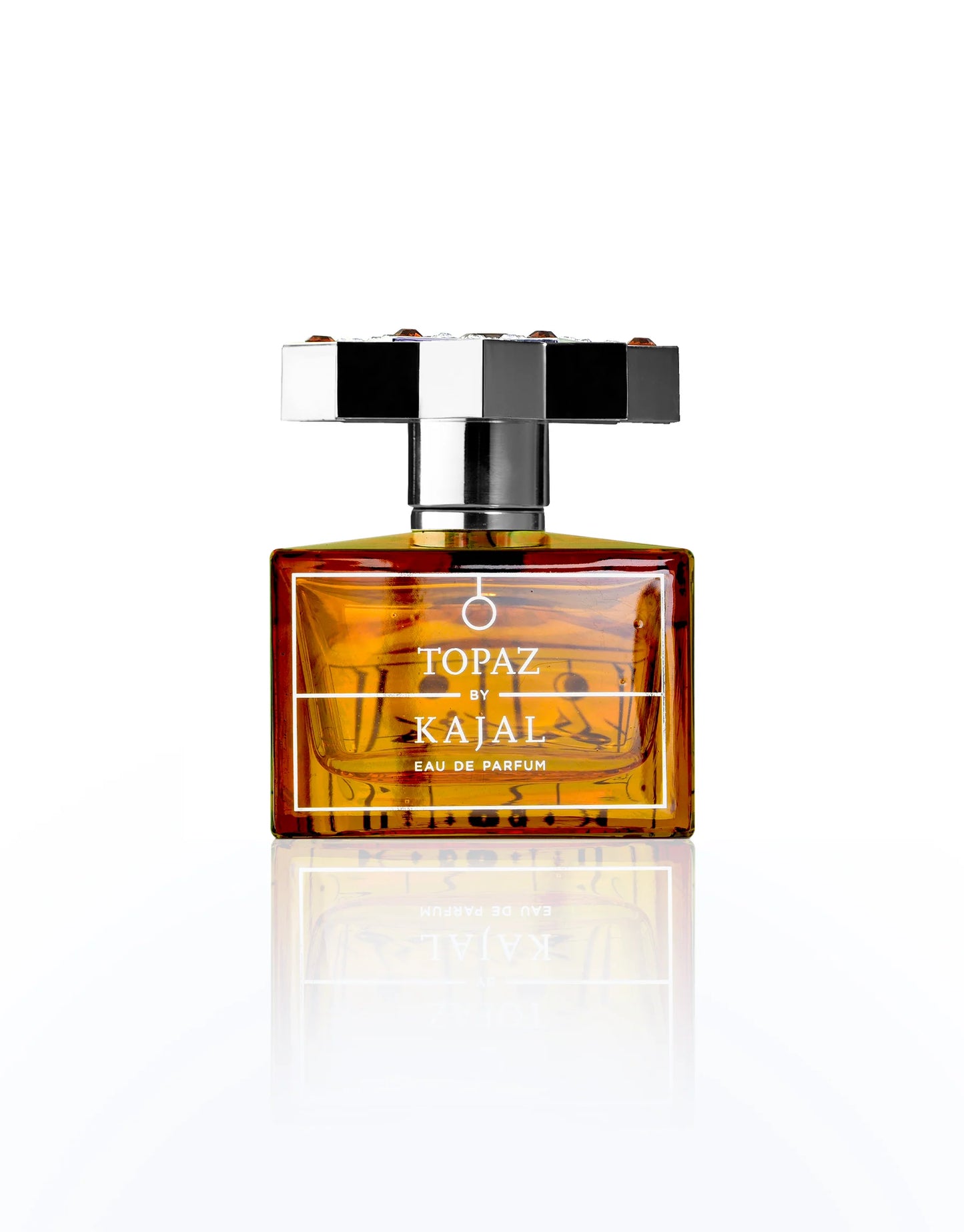 Perfume bottle labeled 'Topaz by Kajal' on a white background