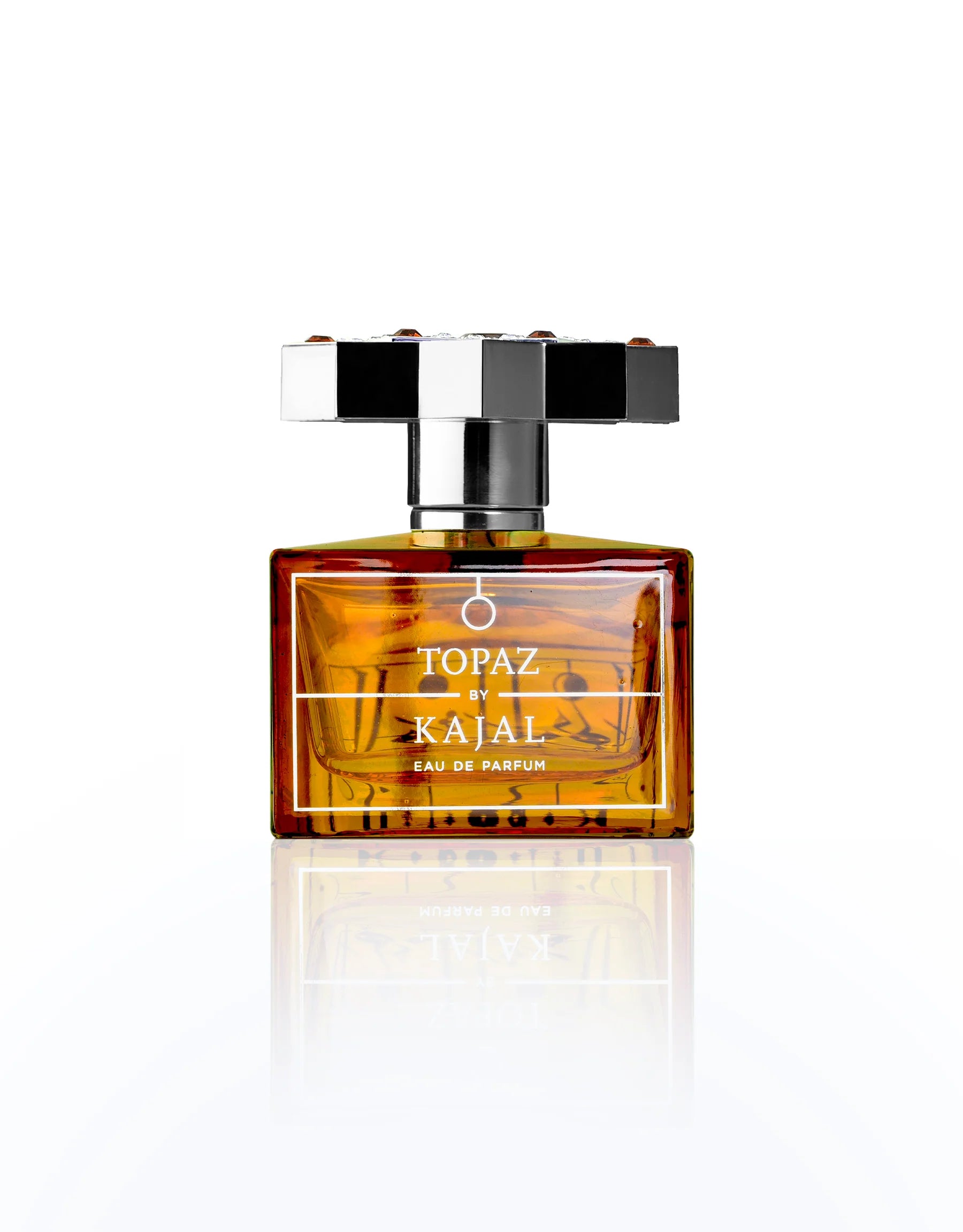 Perfume bottle labeled 'Topaz by Kajal' on a white background